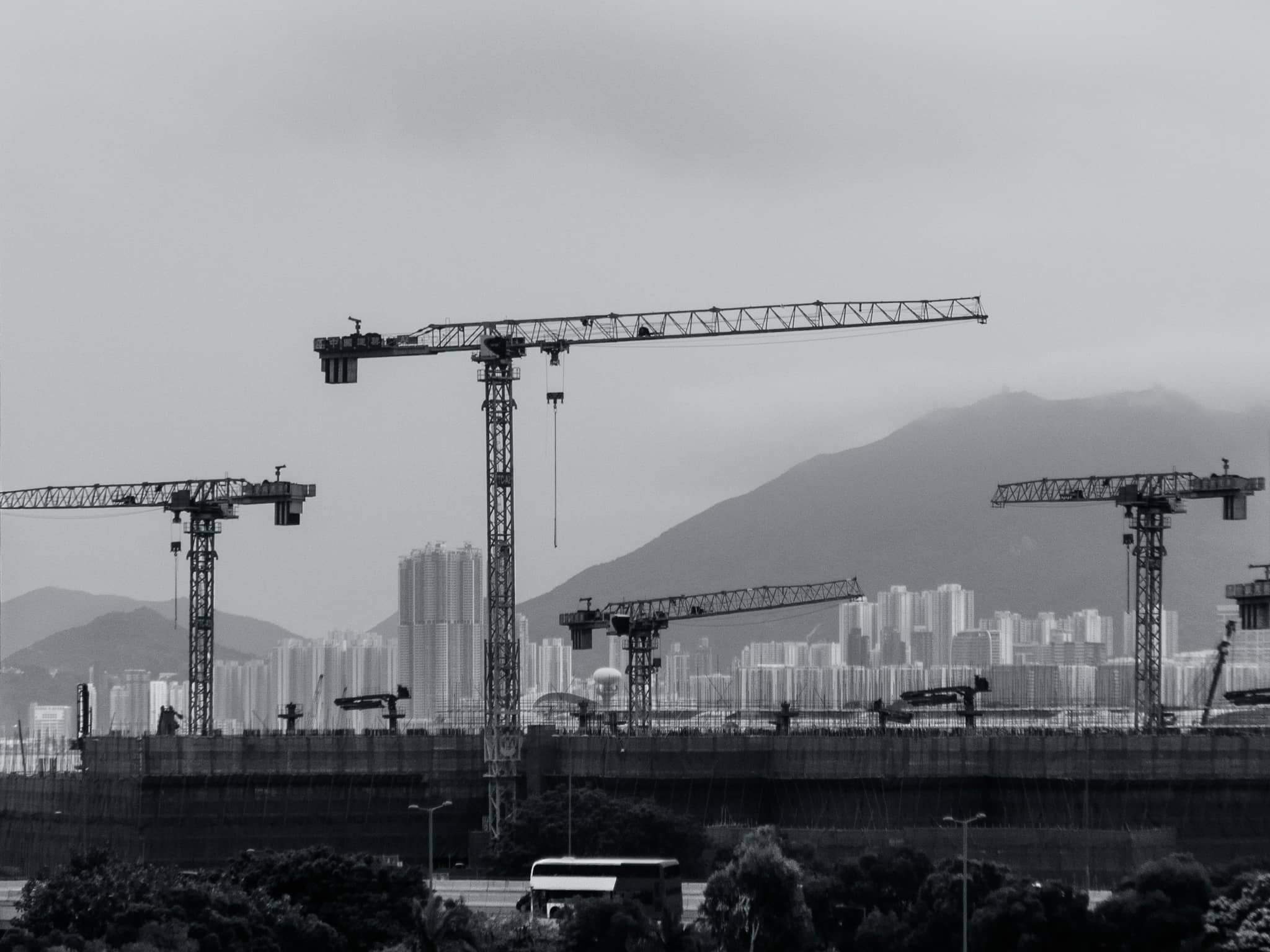 Tower cranes over a city construction site